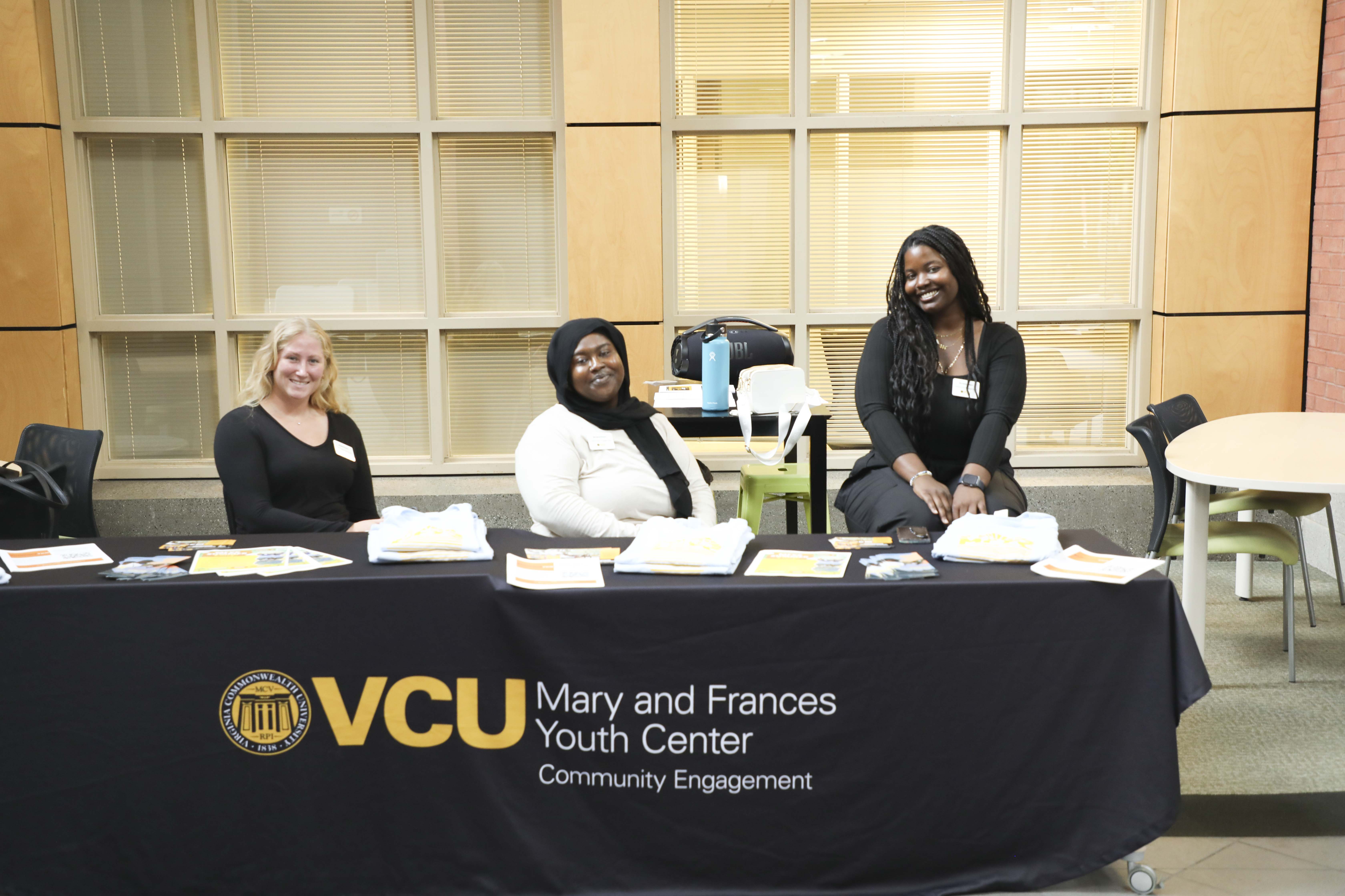 group of students sitting at a table