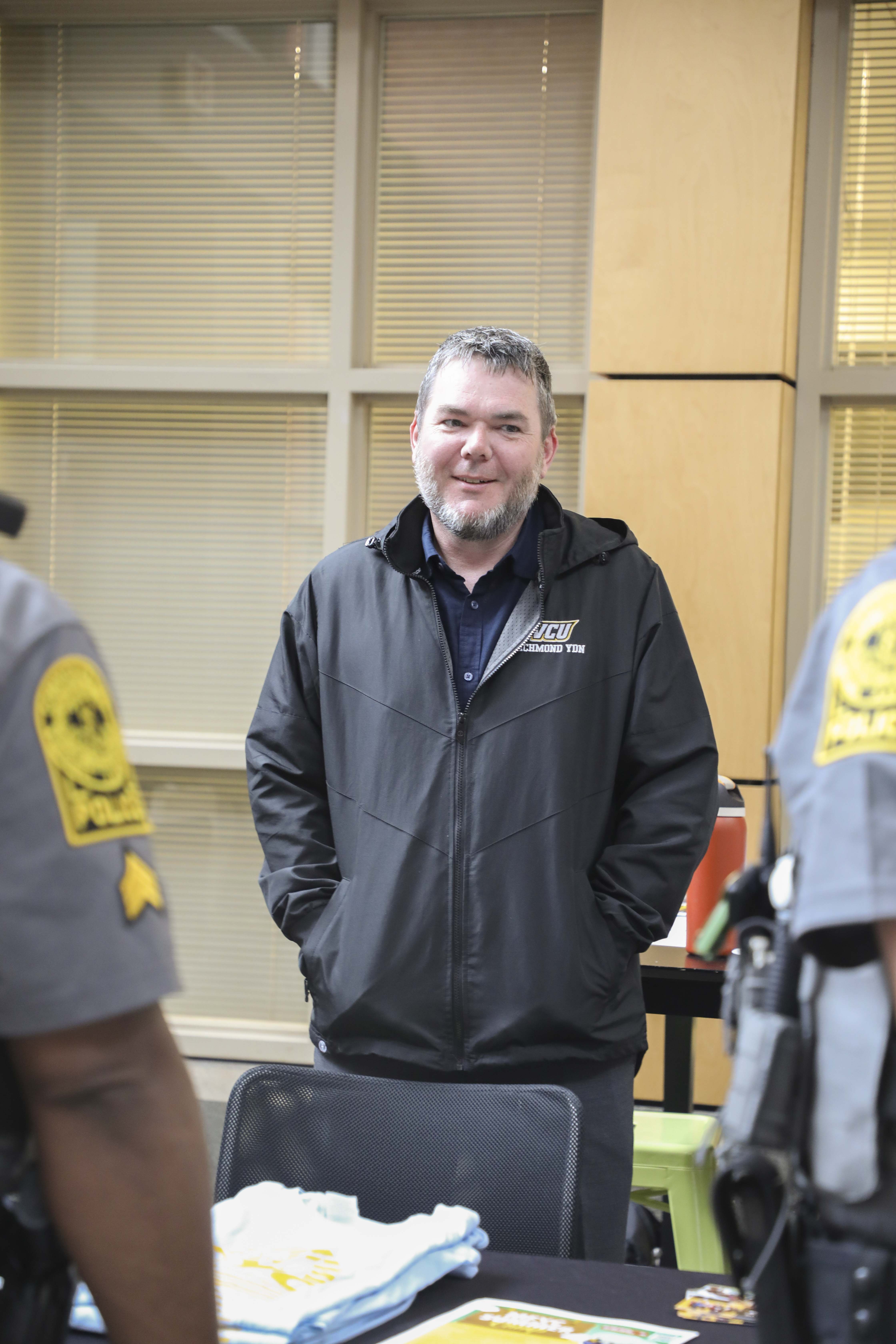 man standing with vcu jacket on