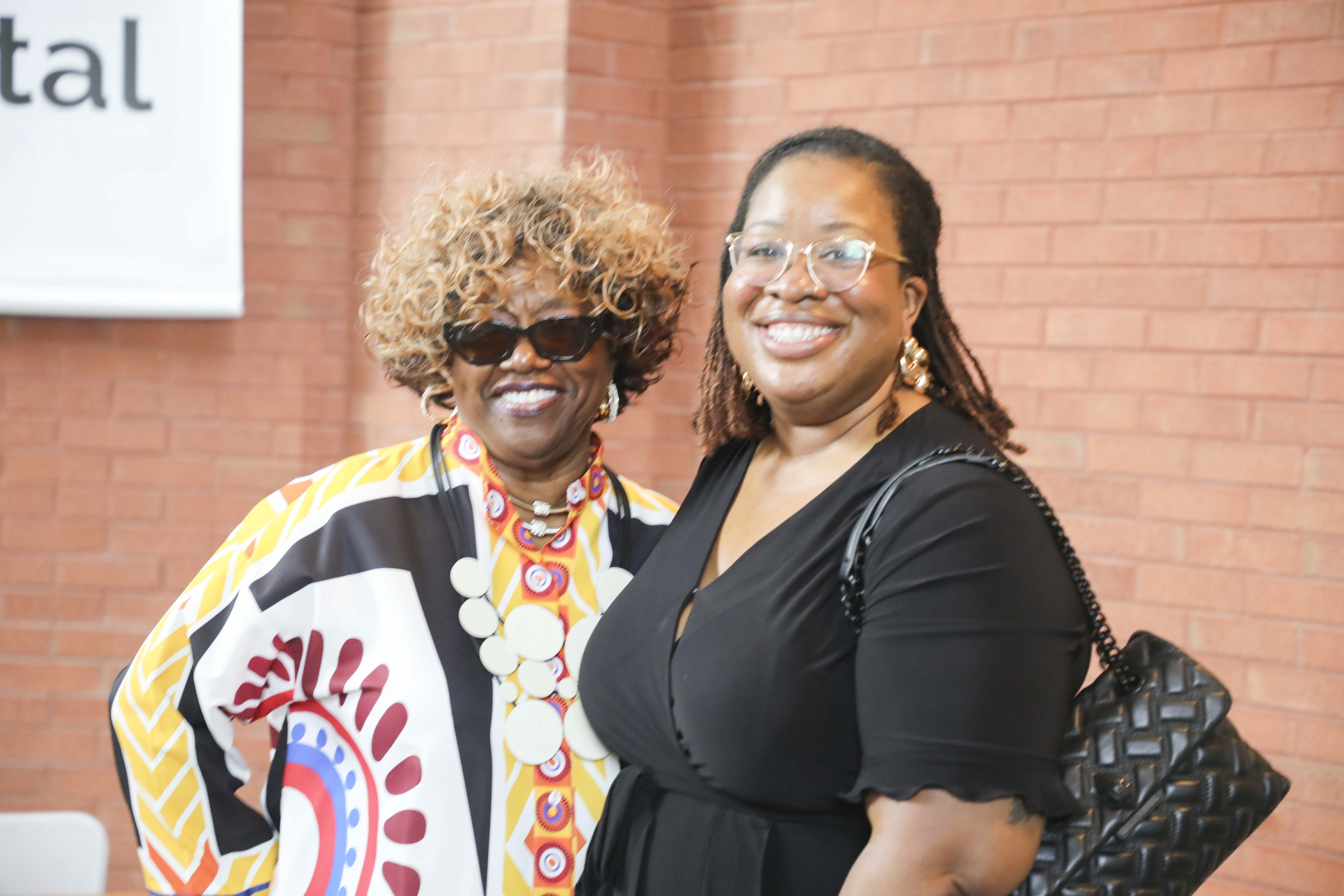 two woman smiling