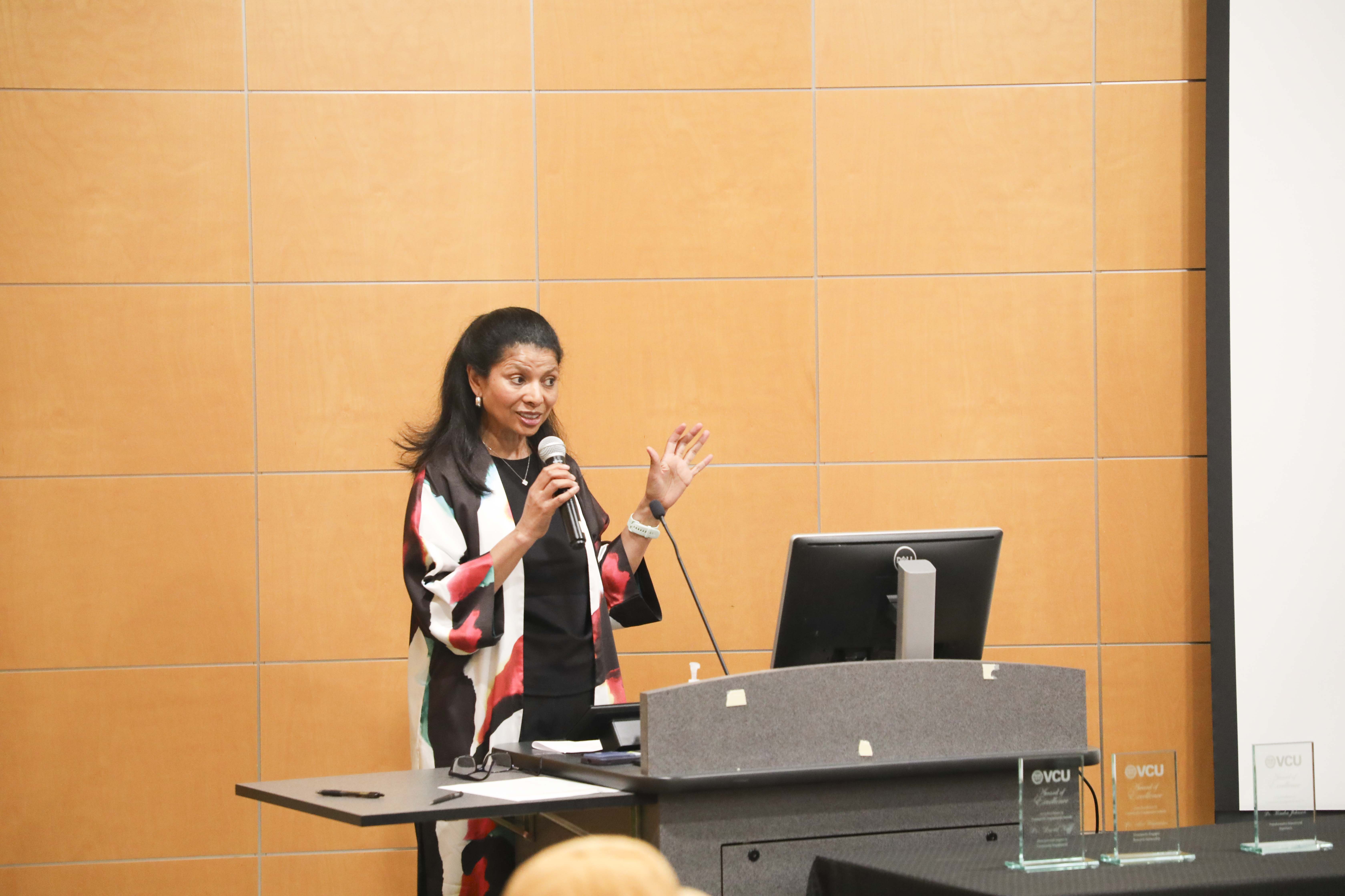 woman talking with a microphone