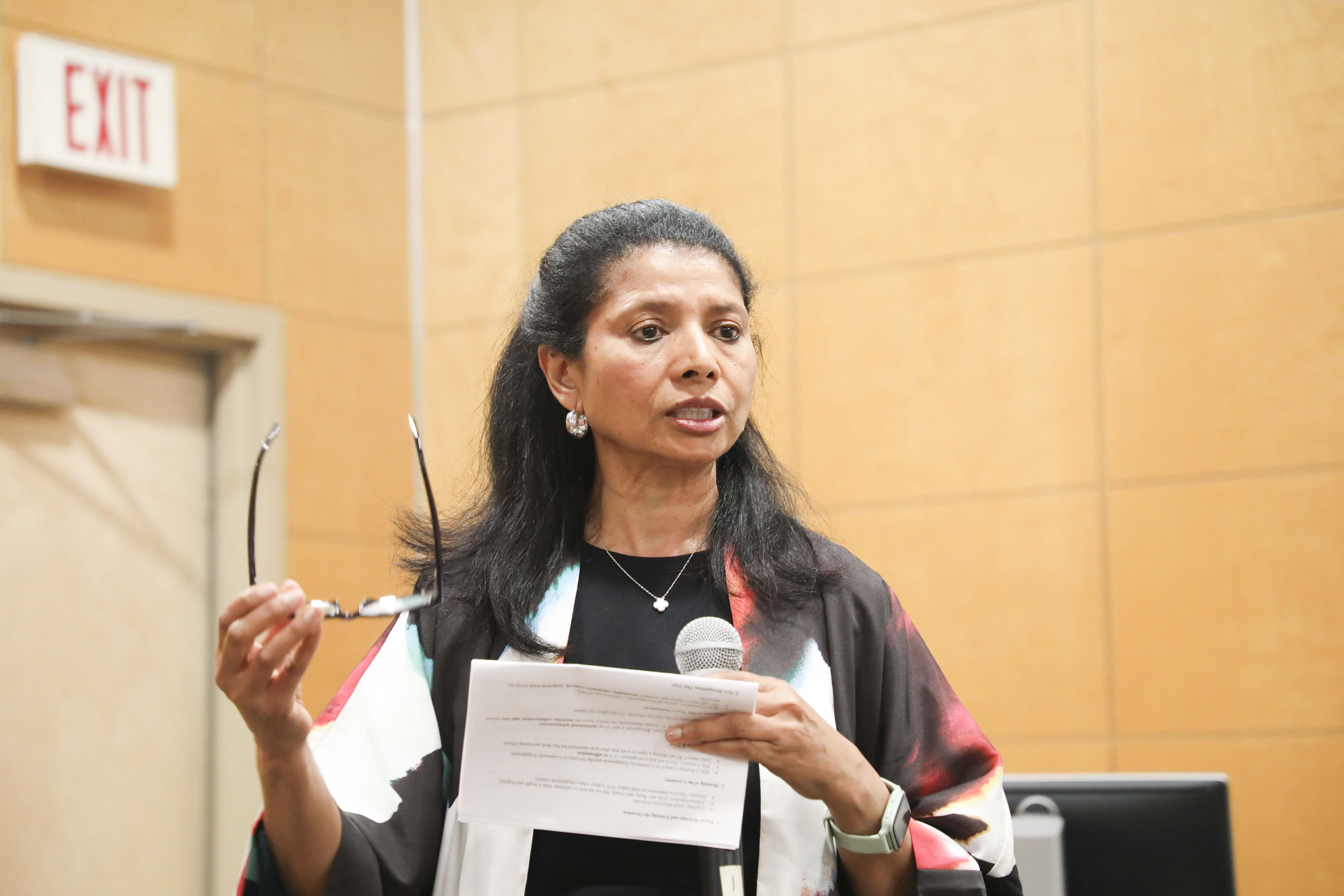 women talking into a microphone