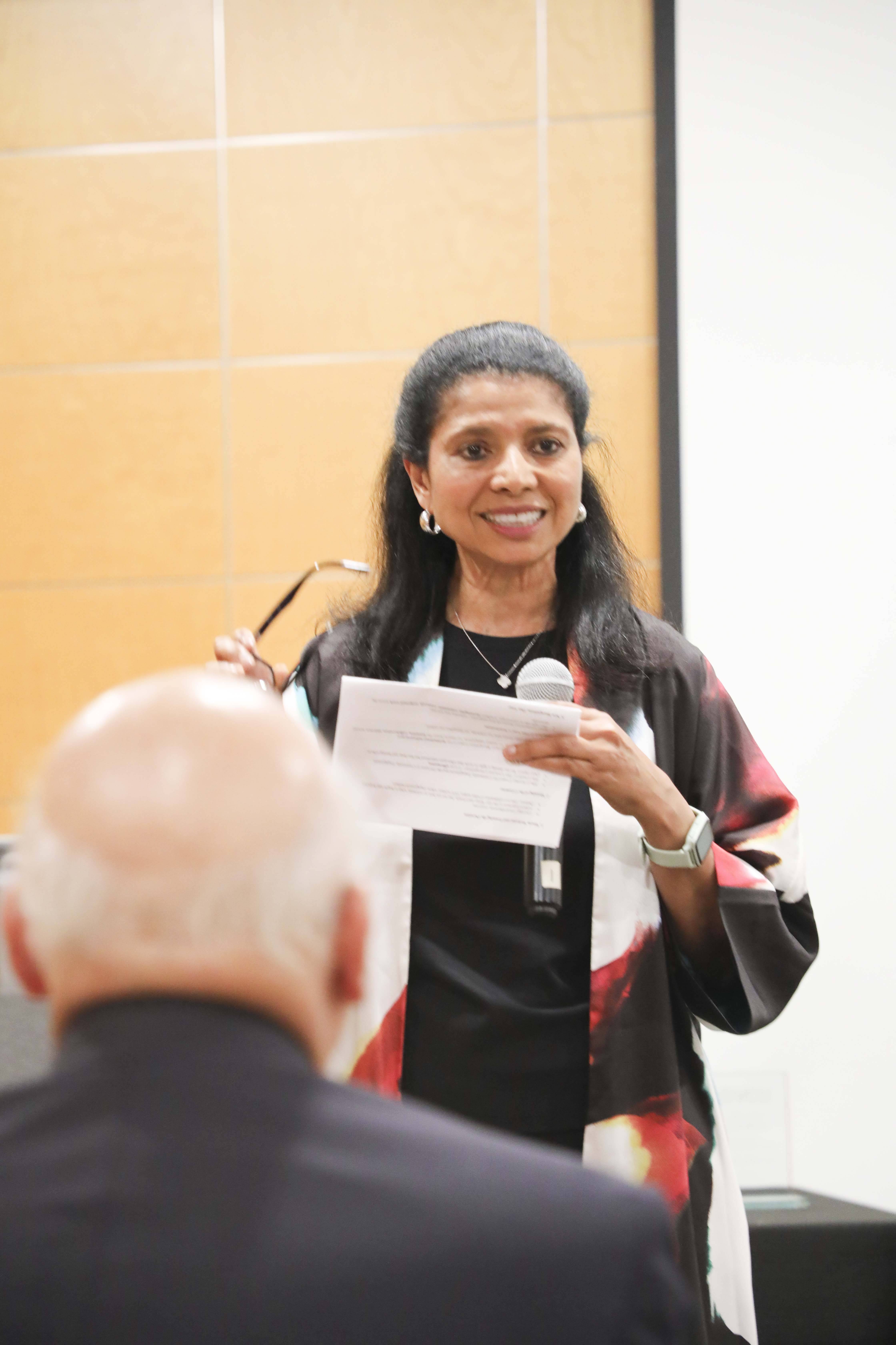 woman talking into a microphone