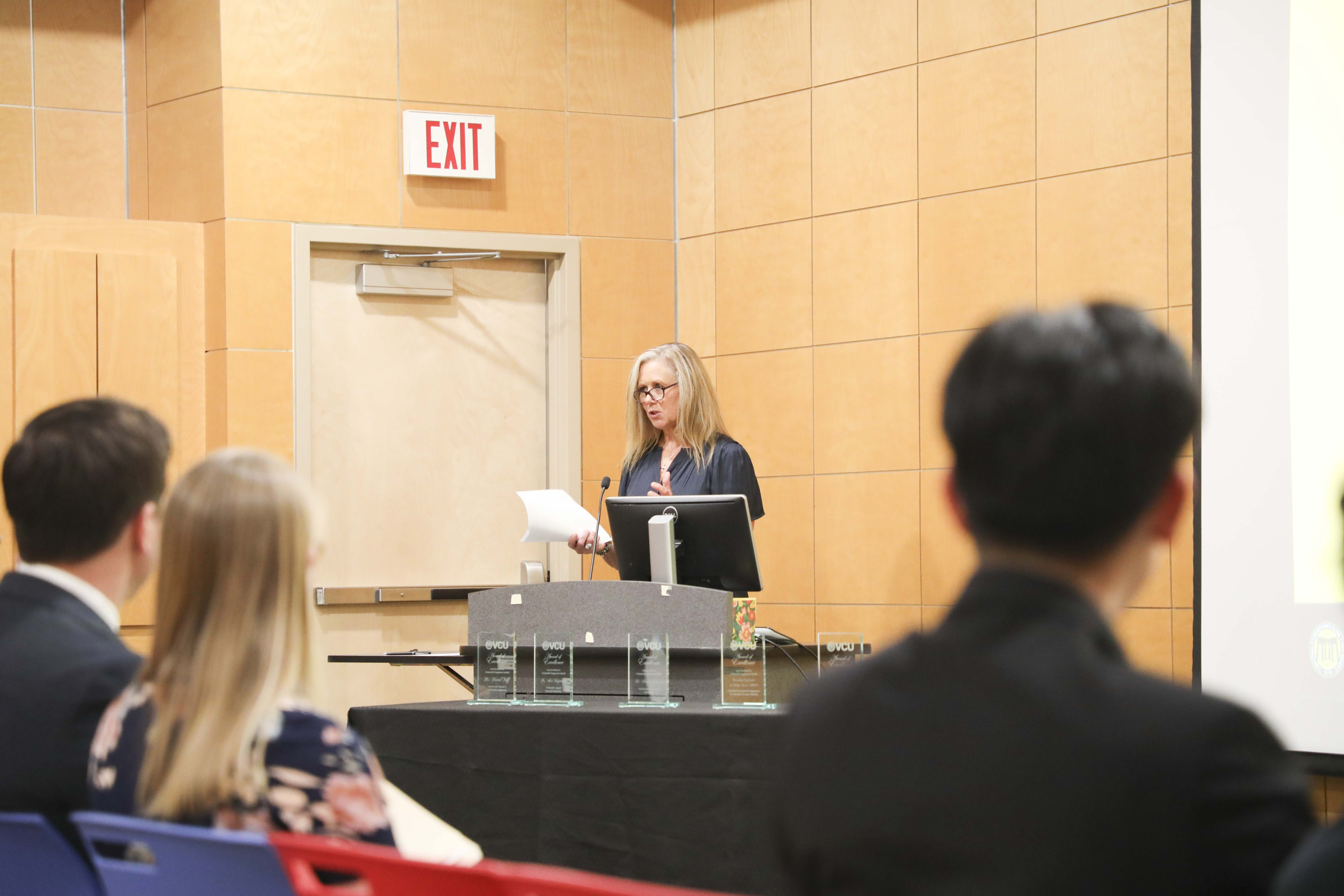 woman talking into microphone
