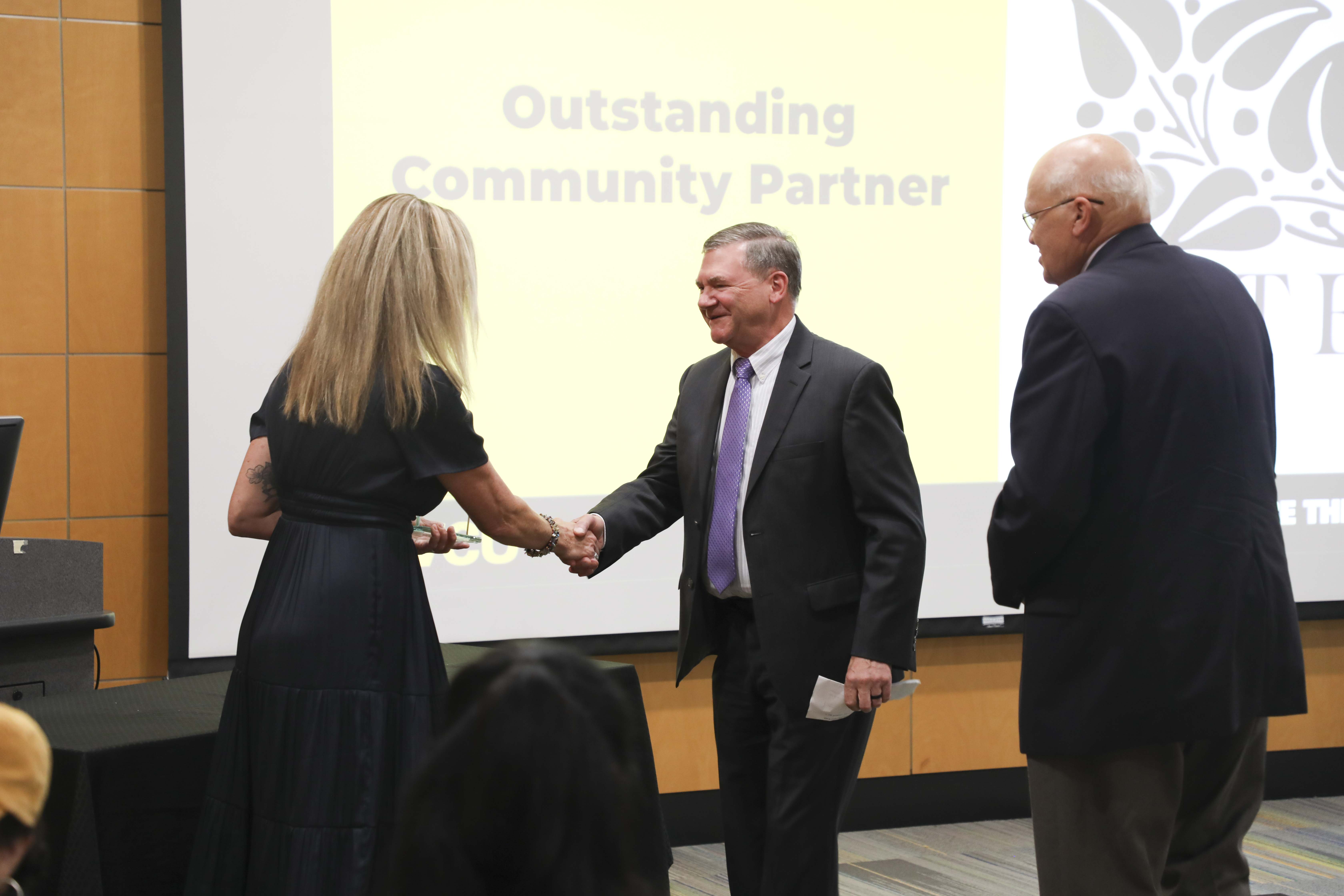 man and woman shaking hands