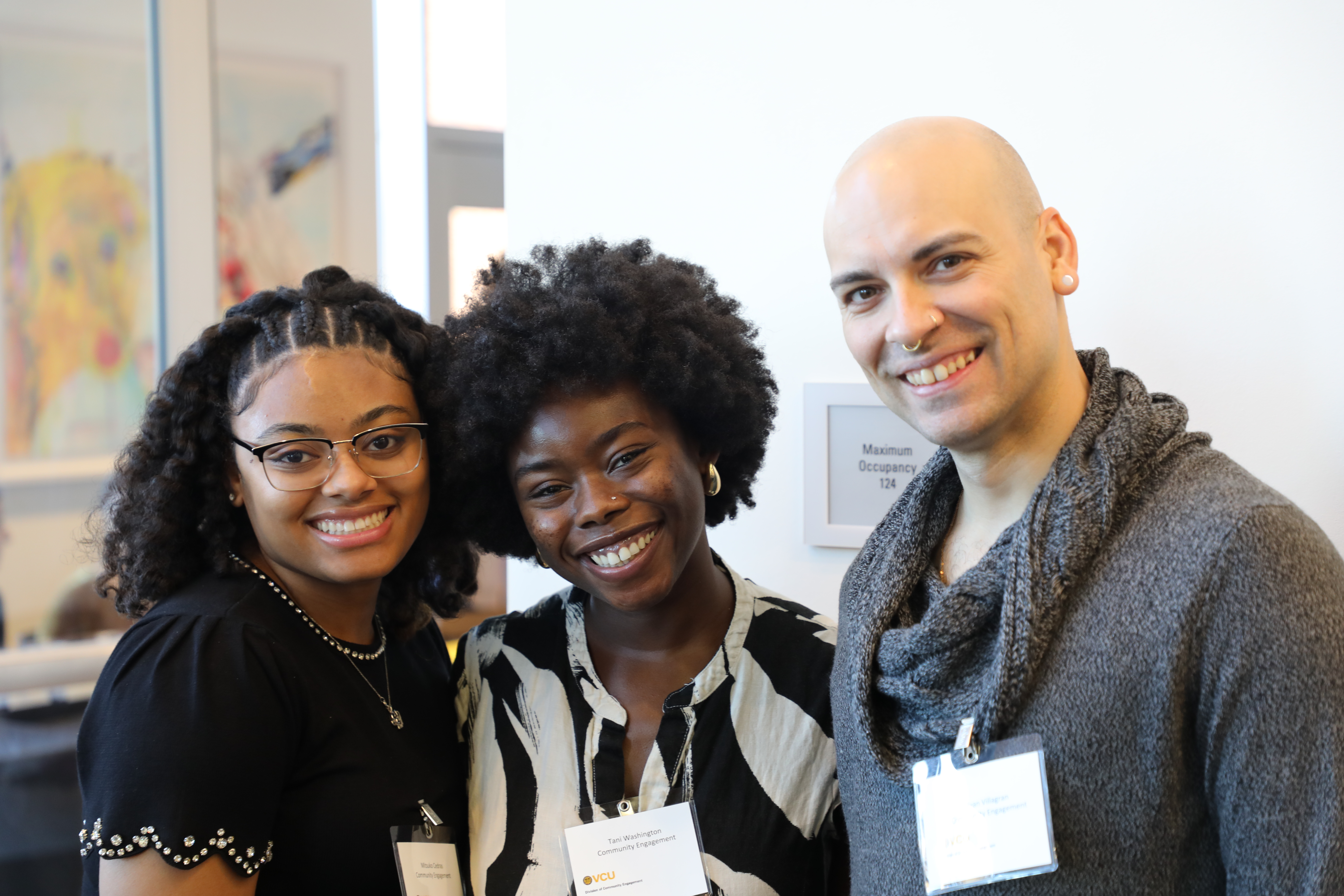 three people smiling