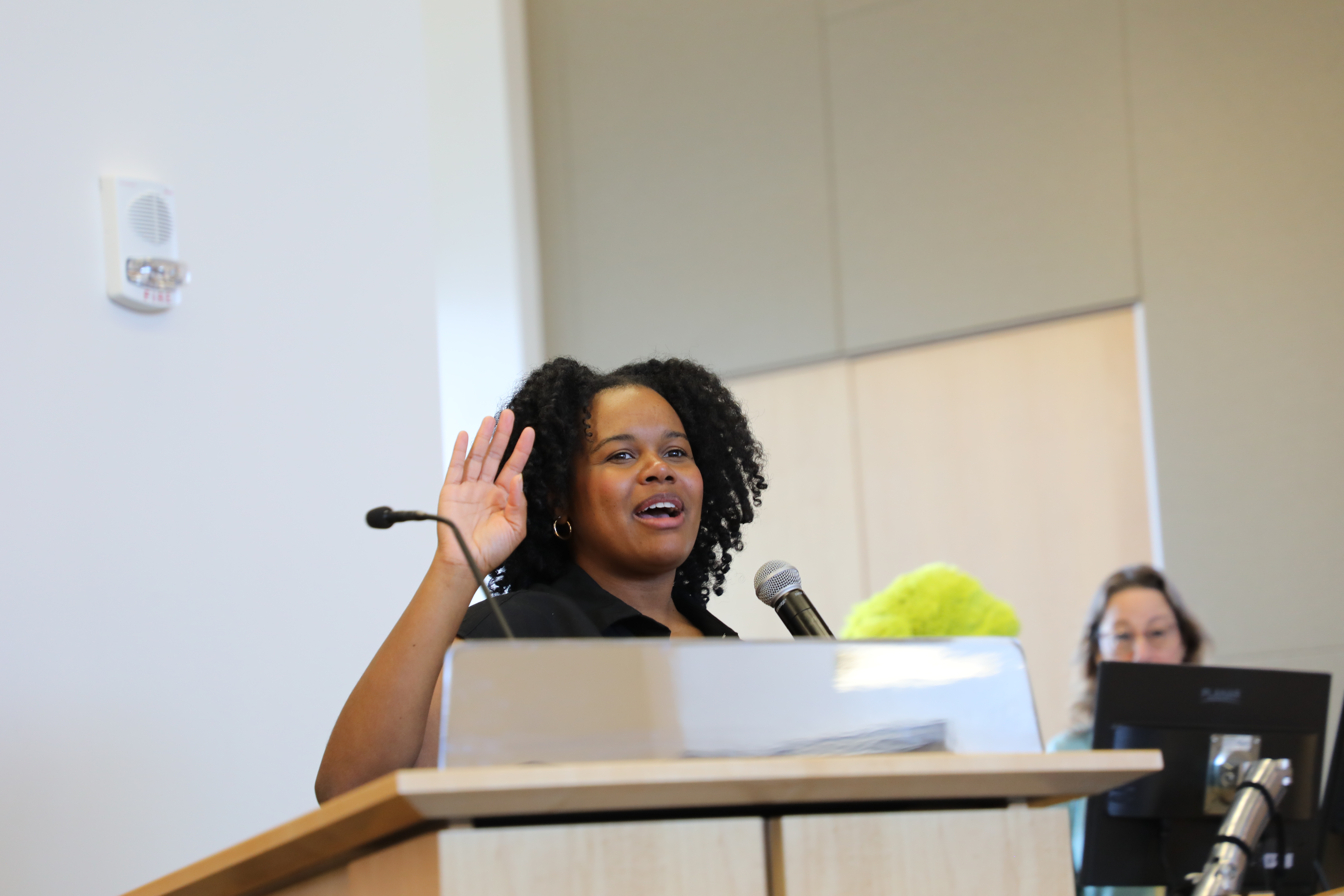 A woman at the podium