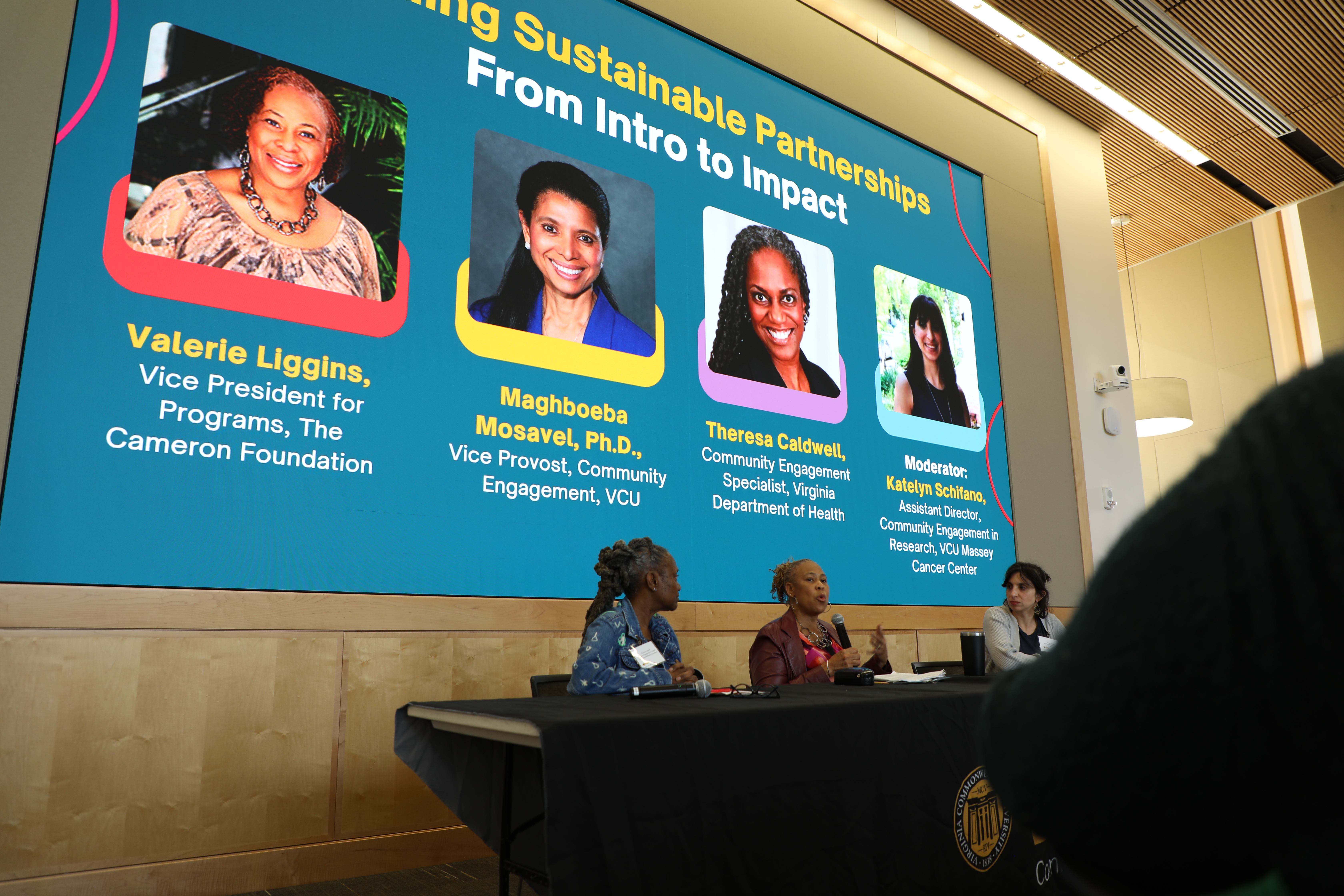 people speaking on a panel