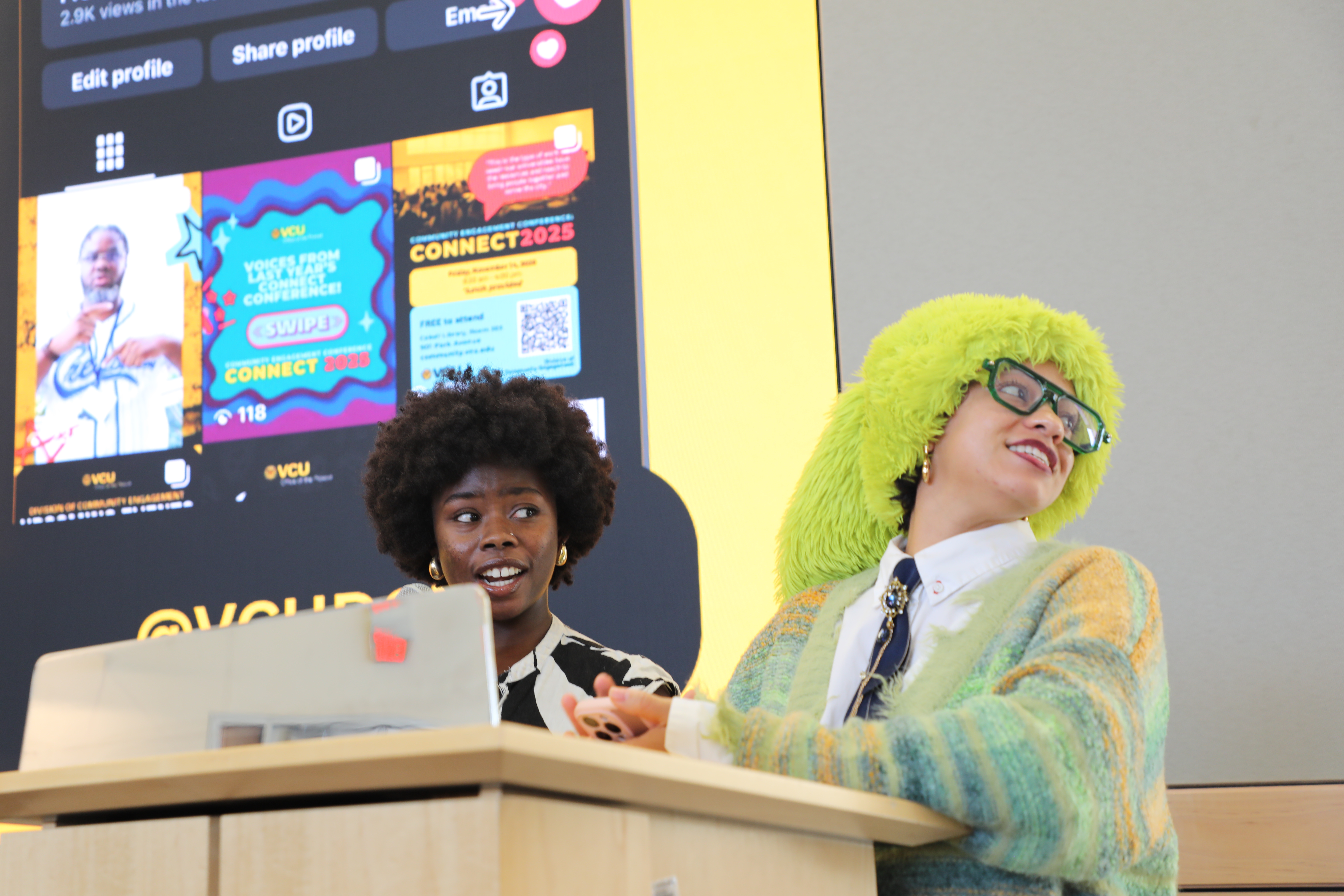 two women standing at a podium