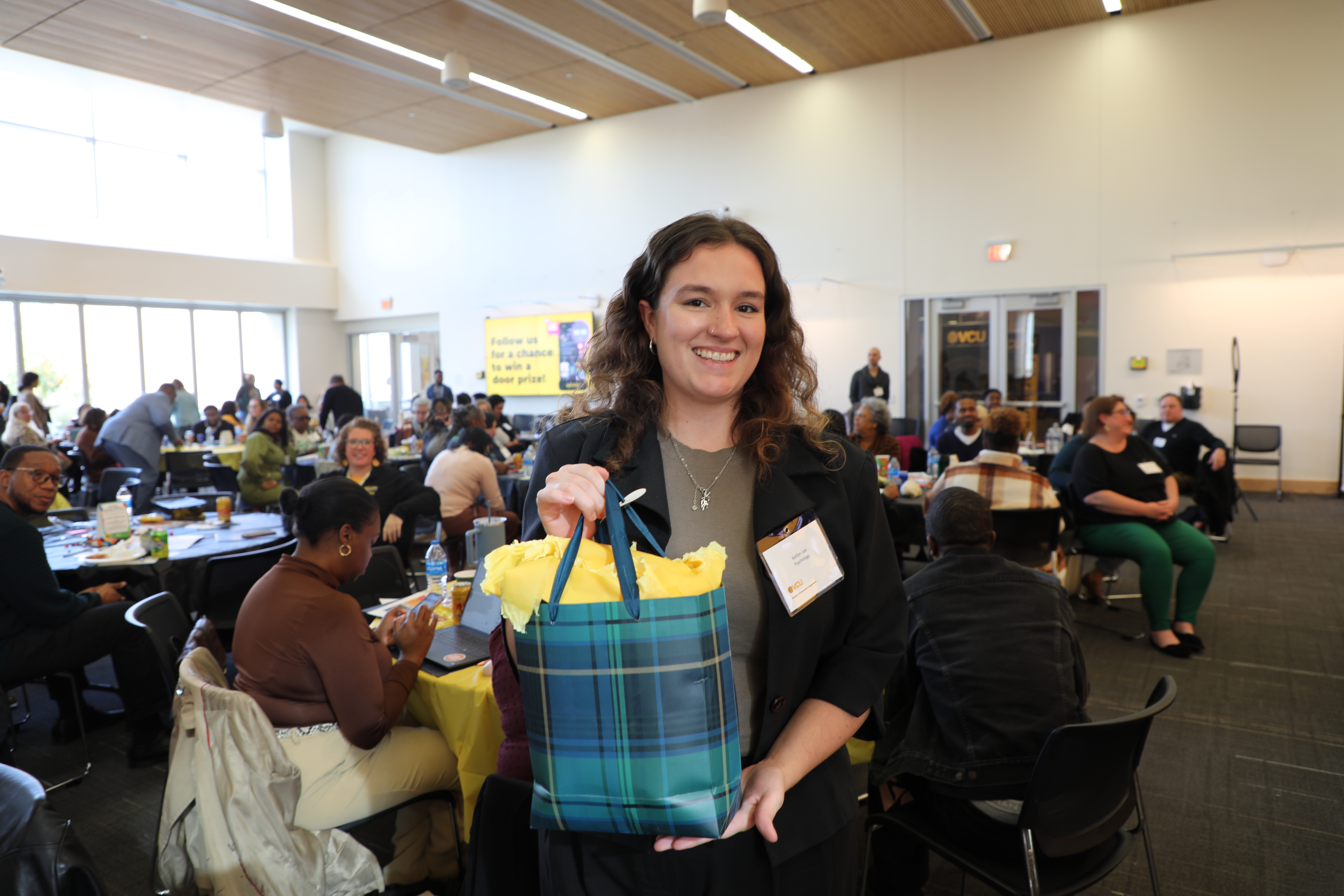 A woman holding her prize