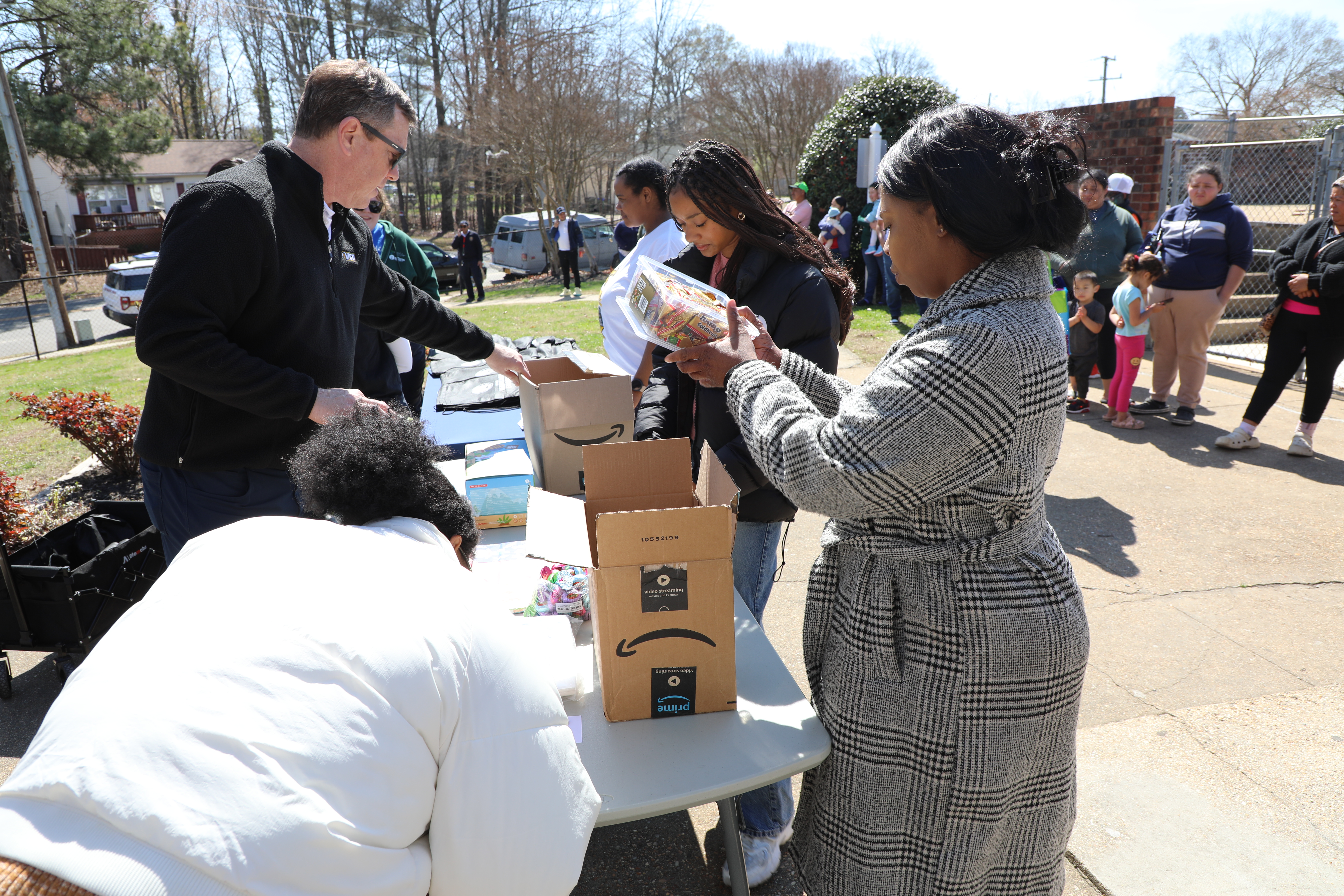 Faculty, staff, and students packing easter kits