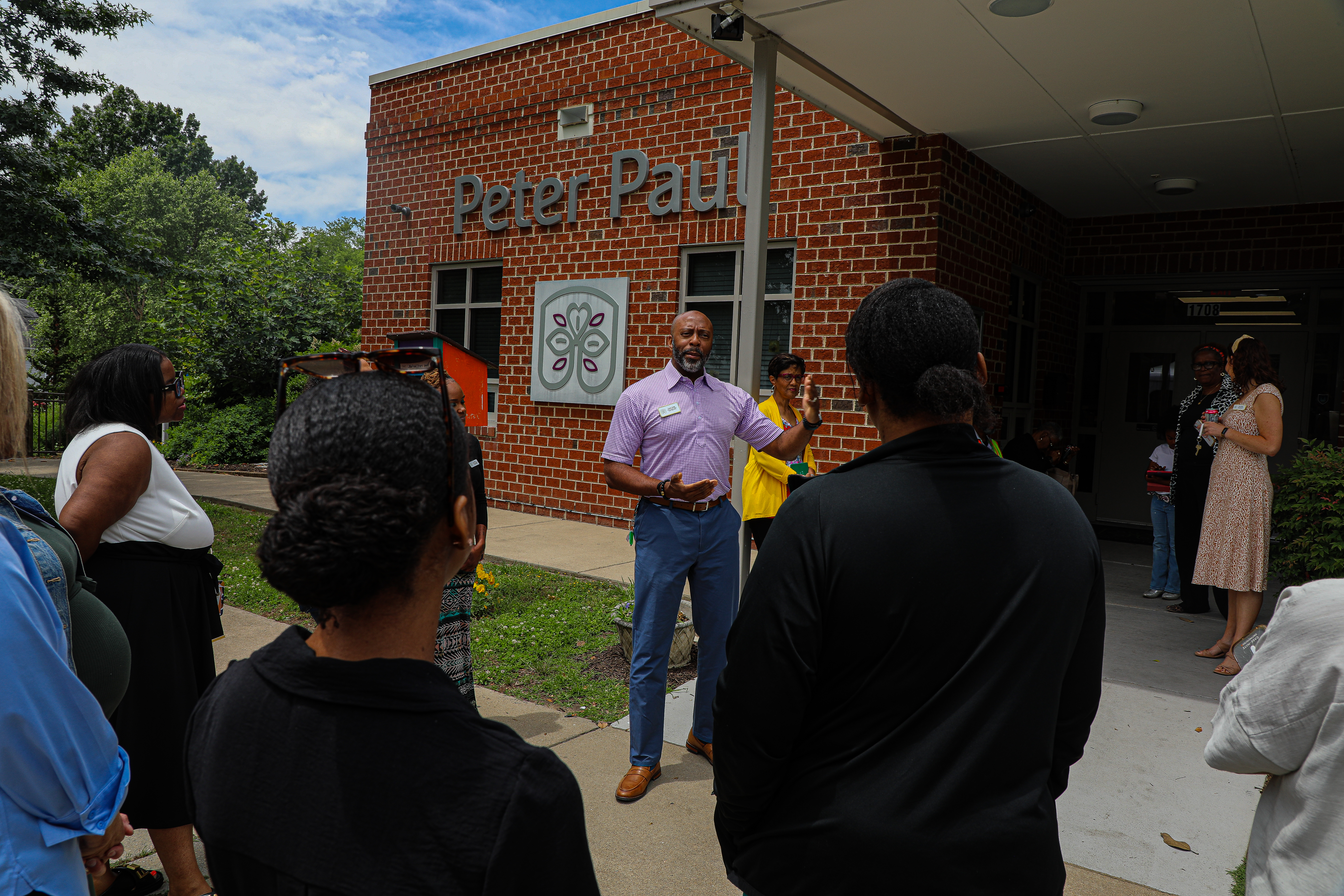 A group of staff and community partners talking