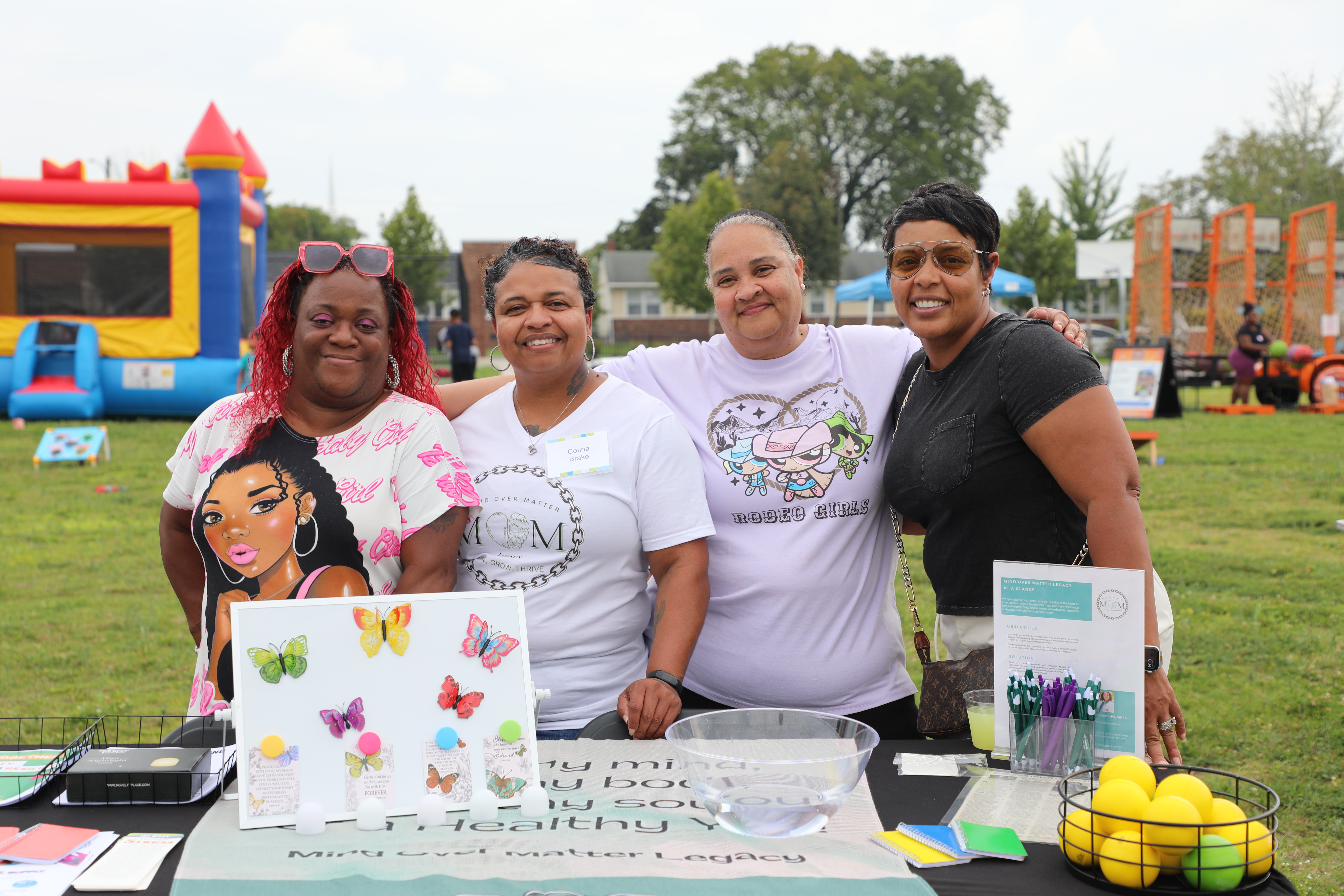A group photo of women standing at a table