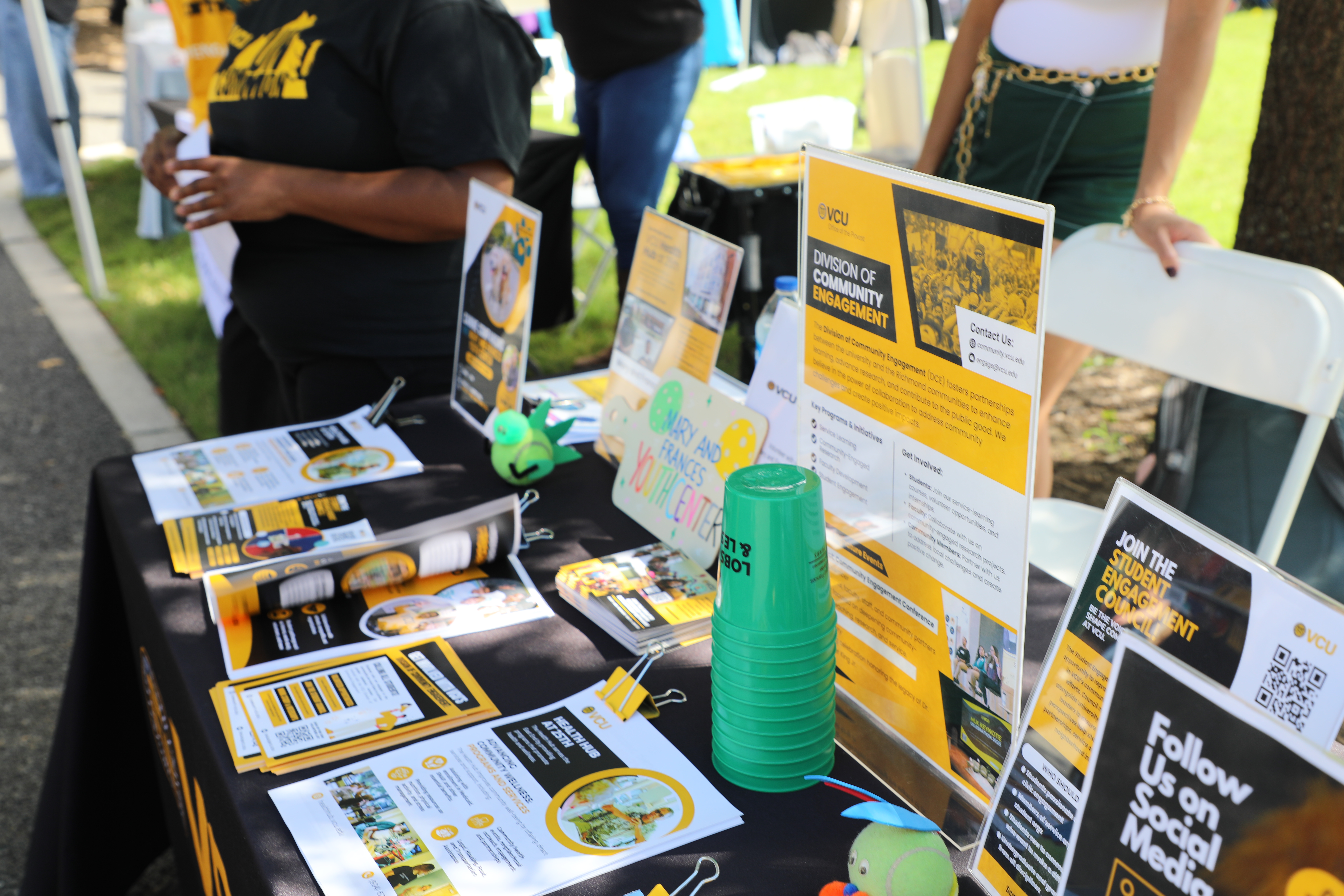 a table of marketing material about Division of Community Engagement
