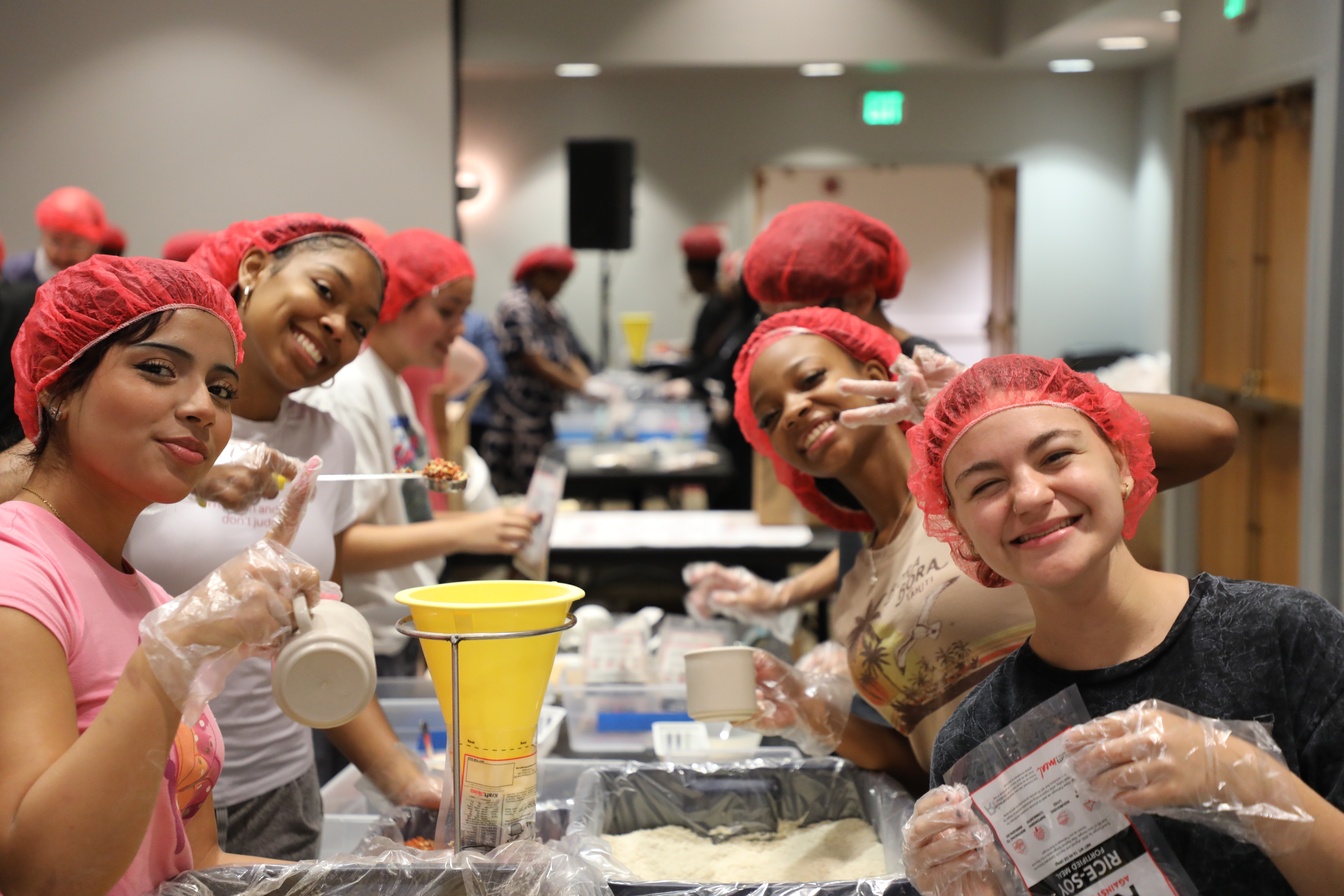 A group of student packing rice for rise against hunger
