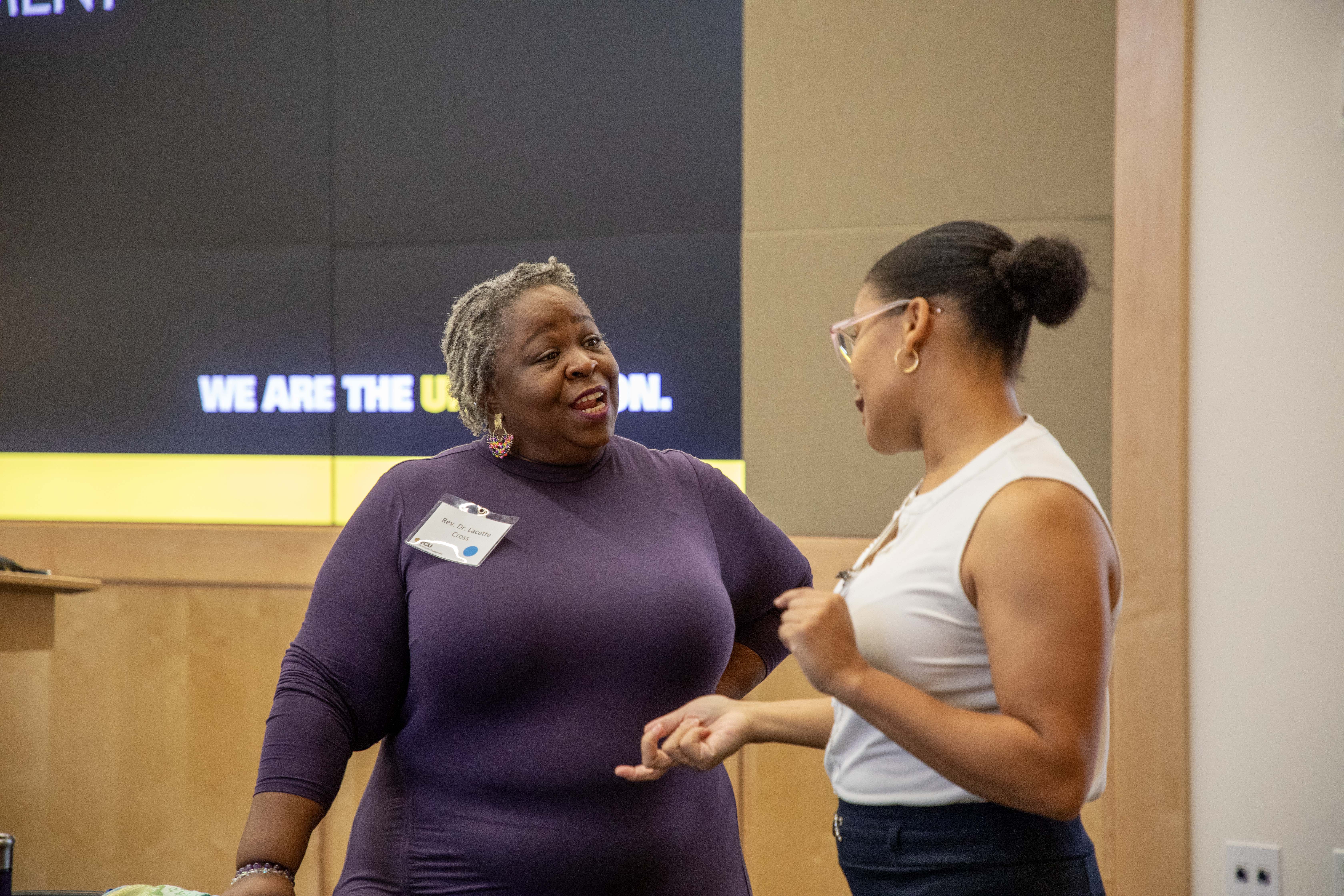 Two women speaking