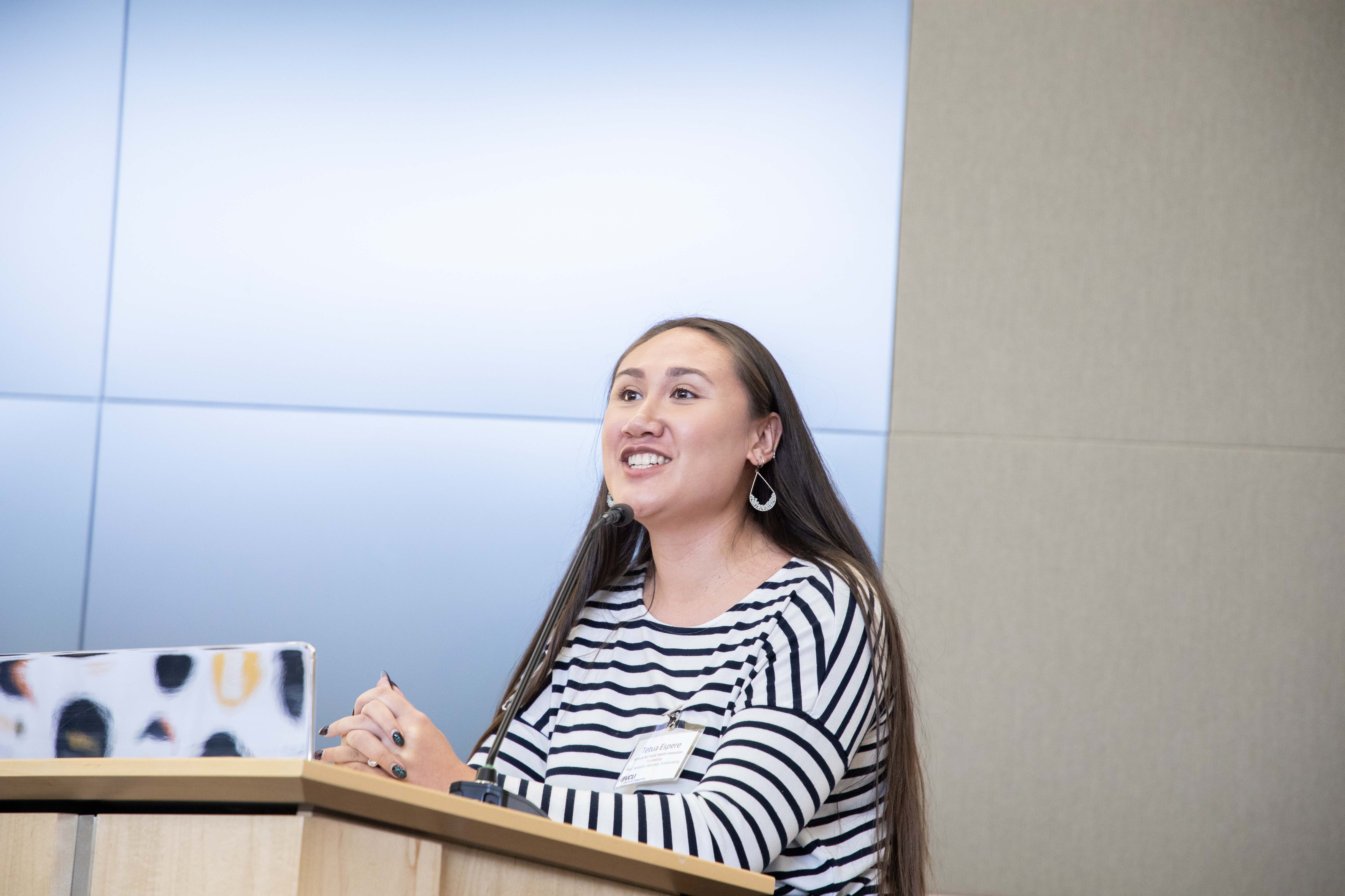 A women speaking into a microphone for pitch training